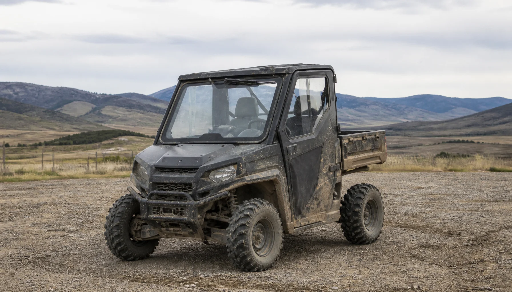 A used utility machine parked on an Alberta gravel lot before an inspection