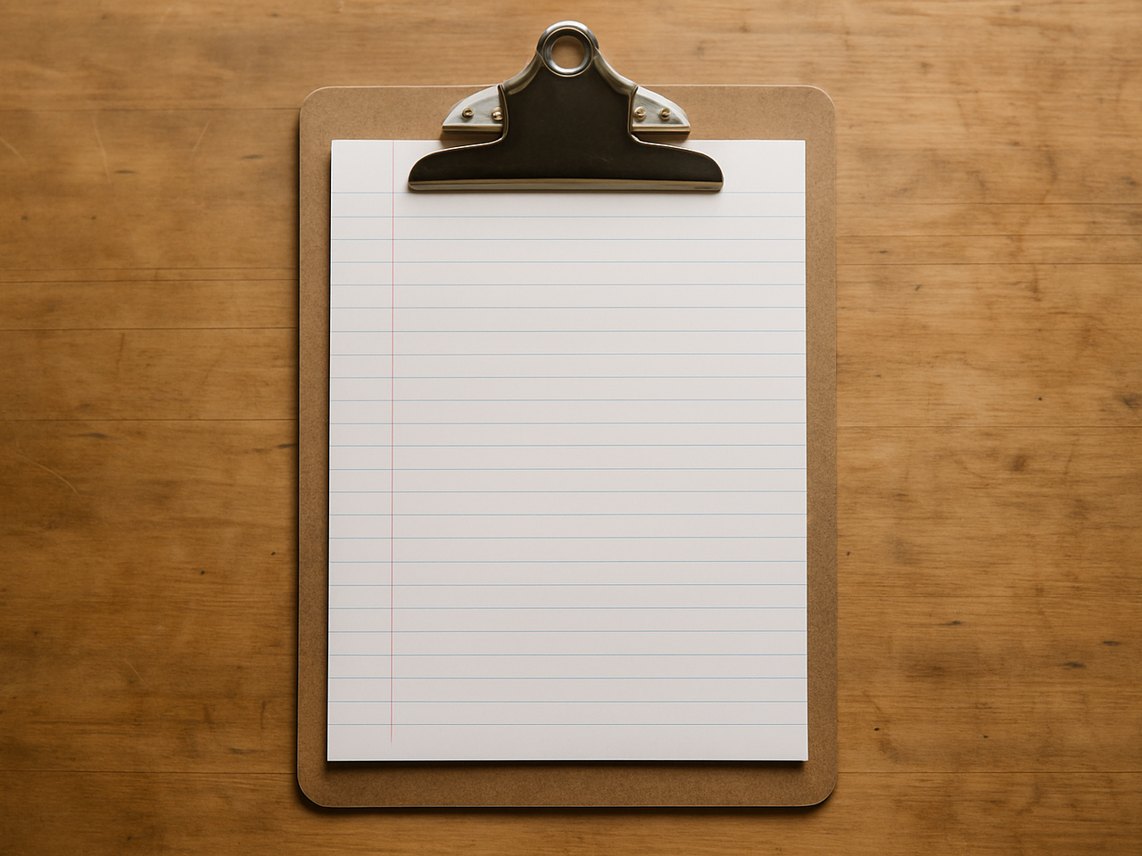 A plain brown hardboard clipboard holding a single sheet of blank ruled paper on a warm wooden workbench under soft overcast daylight